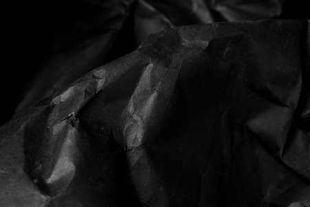 black creased crumpled paper background grunge texture backdrop