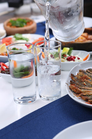 Turkish and Greek Traditional Dinning Table with Special Alcohol Drink Raki. Ouzo and Turkish Raki...