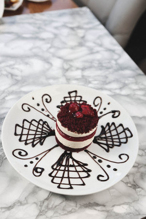 Board with delicious cake on table