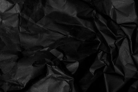 black creased crumpled paper background grunge texture backdrop