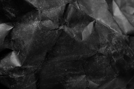 black creased crumpled paper background grunge texture backdrop