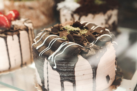 Board with delicious cake on table