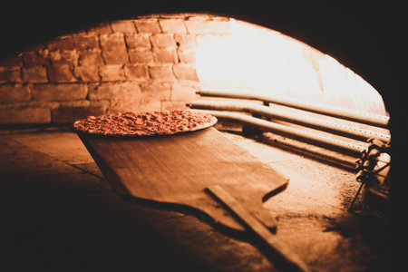 In a restaurant, pita or pita bread cooking in oven or stove. Bakery or bakehouse concept image.