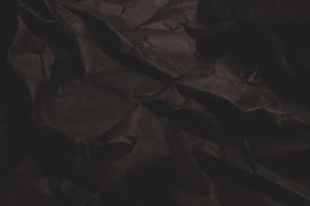 black creased crumpled paper background grunge texture backdropの写真素材