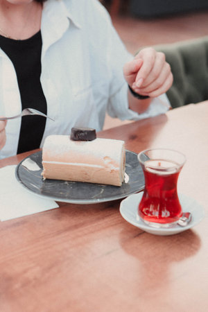 Board with delicious cake on table