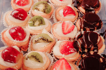 Board with delicious cake on tableの写真素材