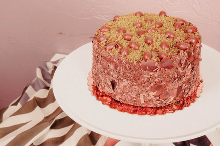 Board with delicious cake on table