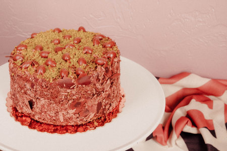 Board with delicious cake on table
