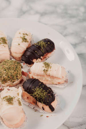 Board with delicious cake on tableの写真素材