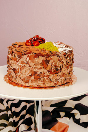 Board with delicious cake on table