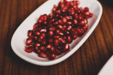 Plate with delicious mixed fruits and sliced fruitsの写真素材