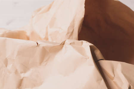 orange creased crumpled paper background grunge texture backdropの写真素材