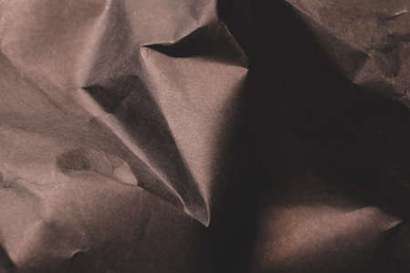 black creased crumpled paper background grunge texture backdropの写真素材