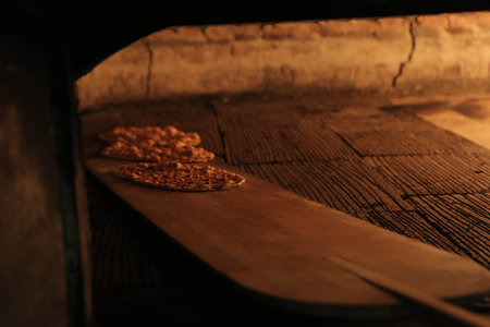 In a restaurant, pita or pita bread cooking in oven or stove. Bakery or bakehouse concept image.の写真素材