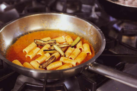 pot with cake on the fire stove cookingの写真素材