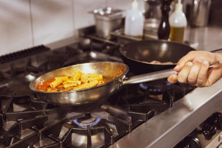 pot with cake on the fire stove cookingの写真素材