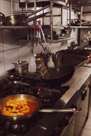 pot with cake on the fire stove cookingの写真素材