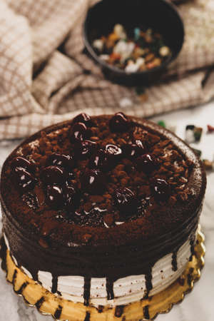 Board with delicious cake on tableの写真素材