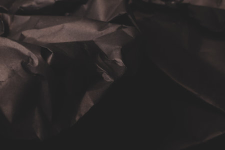 black creased crumpled paper background grunge texture backdrop