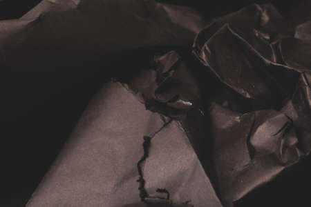 black creased crumpled paper background grunge texture backdropの写真素材
