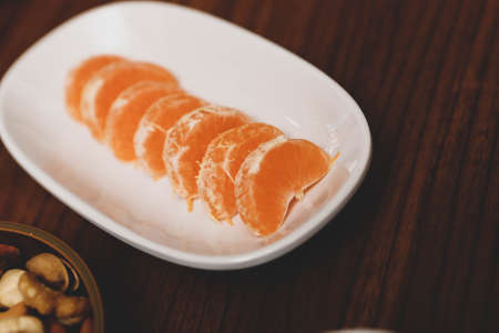 Plate with delicious mixed fruits and sliced fruitsの写真素材