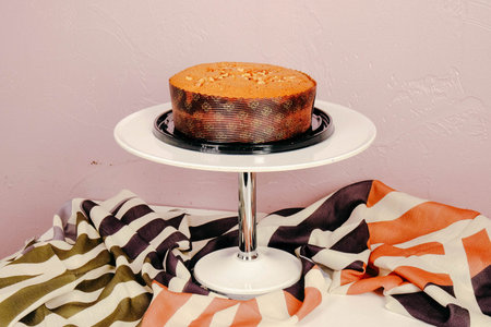 Board with delicious cake on table