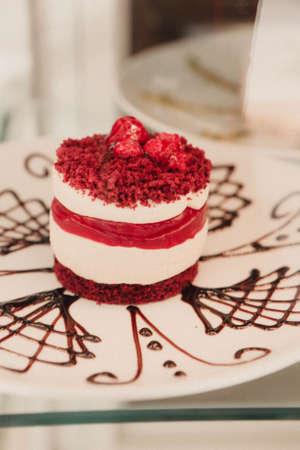 Board with delicious cake on tableの写真素材