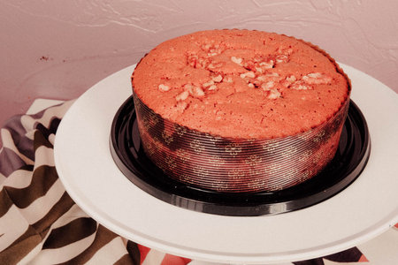 Board with delicious cake on table