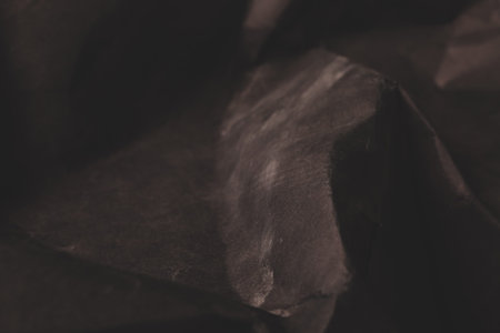 black creased crumpled paper background grunge texture backdrop