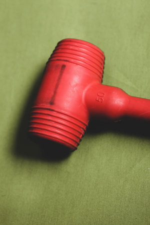 red and black rubber hammer