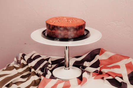 Board with delicious cake on tableの写真素材