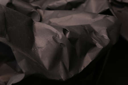 black creased crumpled paper background grunge texture backdropの写真素材