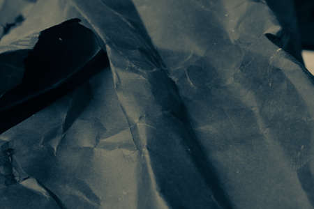 black creased crumpled paper background grunge texture backdropの写真素材