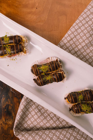 Board with delicious cake on table
