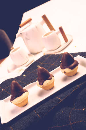 Board with delicious cake on tableの写真素材