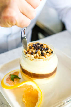 Very delicious dessert in jars, sweet and cakes in jarsの写真素材