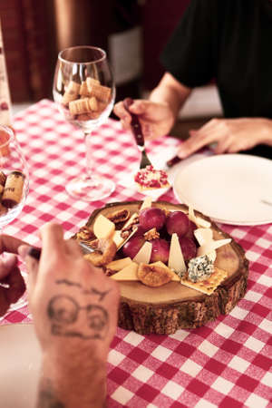 Cheese plate, gourmet wine and cheese charcuterie trayの写真素材
