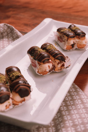 Board with delicious cake on table