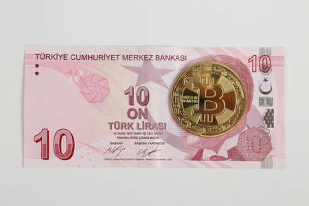 Turkish lira banknotes and bitcoin coinの写真素材