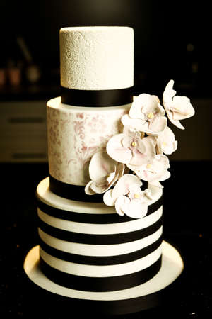 Board with delicious cake on tableの写真素材