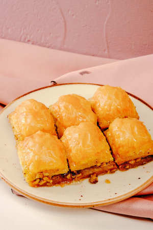 Traditional turkish dessert baklava with cashew, walnuts. Homemade baklava with nuts and honey.