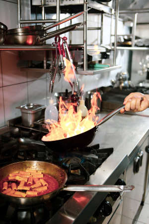 pot with cake on the fire stove cookingの写真素材