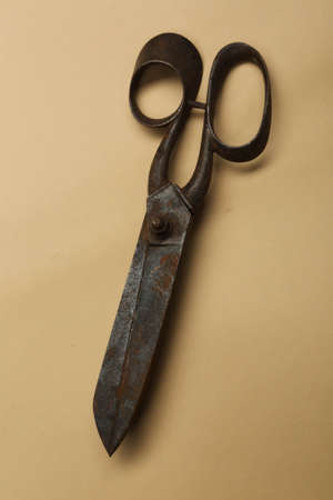 Rusty and old scissors on white backgroundの写真素材