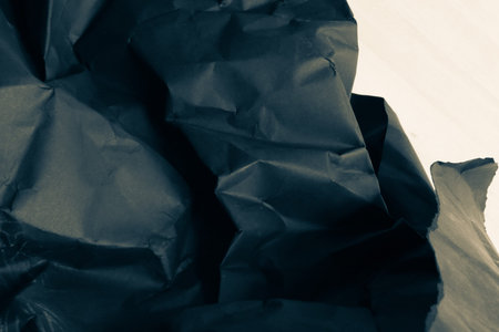 black creased crumpled paper background grunge texture backdrop