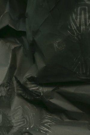 black creased crumpled paper background grunge texture backdrop