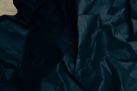 black creased crumpled paper background grunge texture backdrop