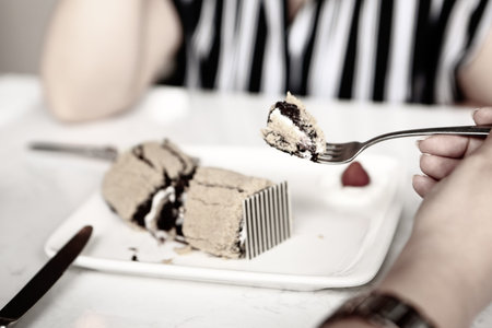 Board with delicious cake on table