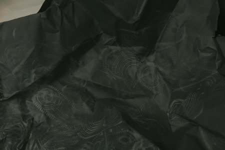 black creased crumpled paper background grunge texture backdrop