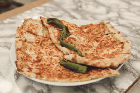 Traditional turkish baked dish pide. Turkish pizza pide, Middle eastern appetizers. Turkish cuisine. Pita with meat fillingの写真素材