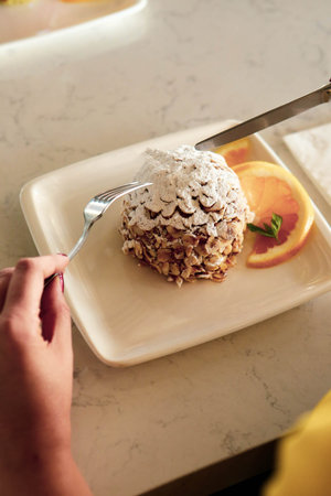 Board with delicious cake on table
